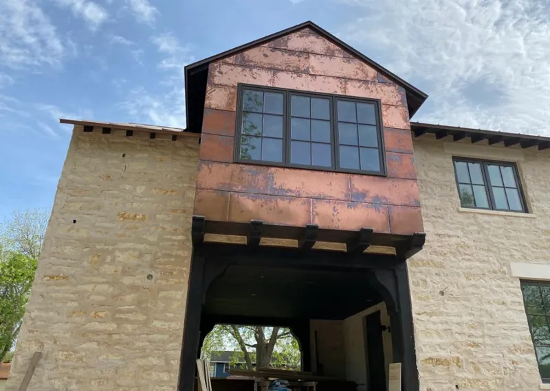 Copper metal panel facade on a stone building for Roof Repair in Merritt Island