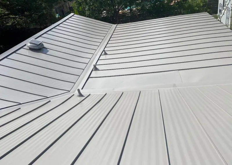 Solar attic fan installed on a metal roof for Roof Ventilation in Merritt Island